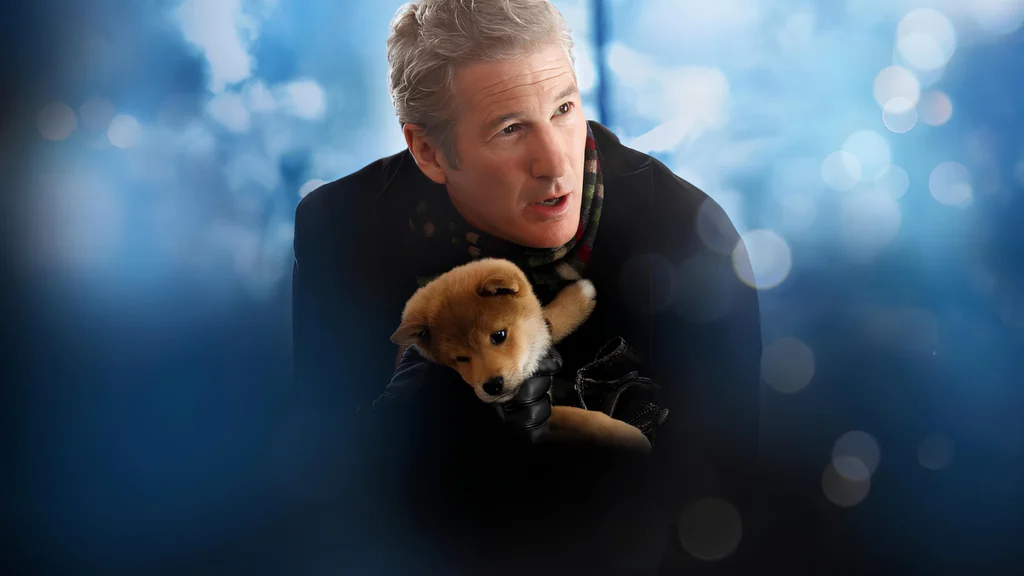 hombre agarrando a un perro de la pelicula de hachiko
